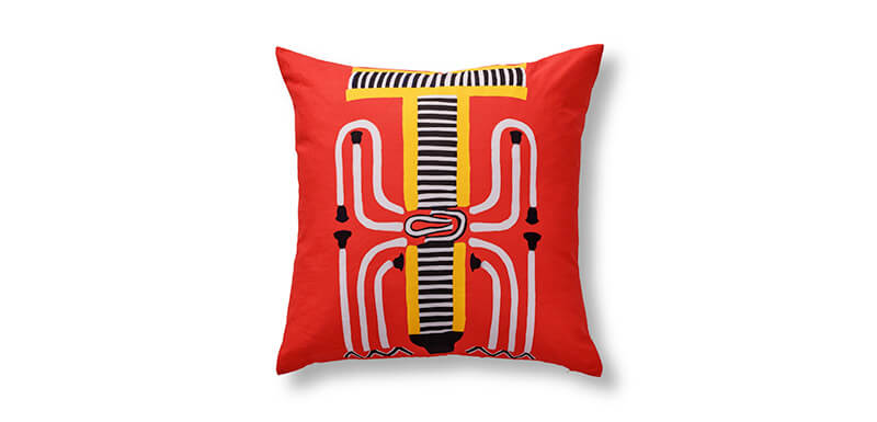 Ann Gish Pillow in bright red with yellow, black and white accents